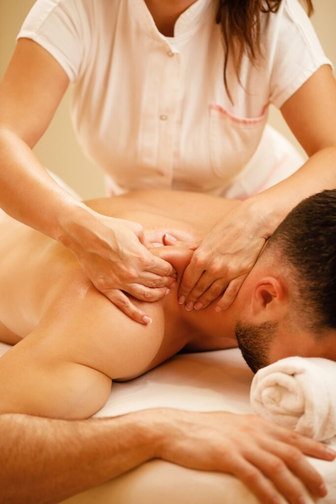 unrecognizable-therapist-massaging-man-s-shoulders-spa-treatment (1)